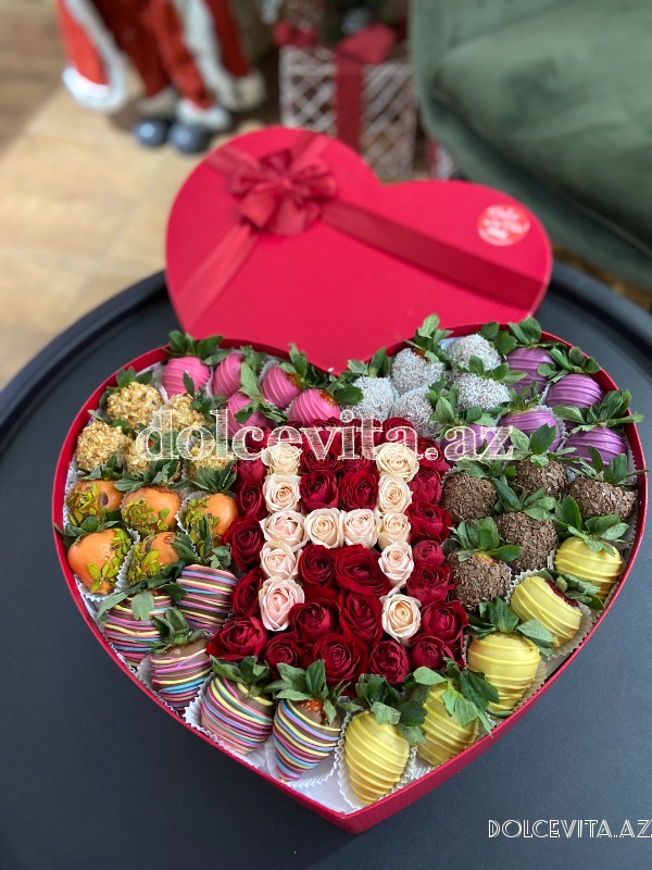 Heart shaped box with spray roses and letter 